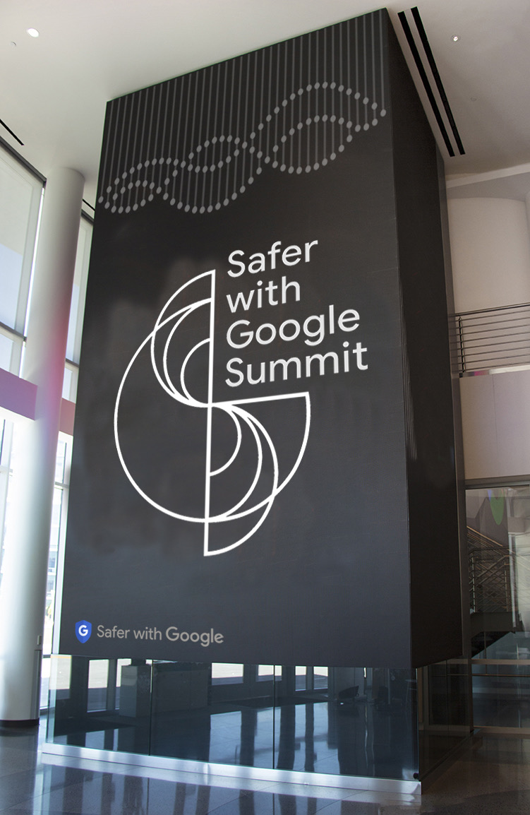Three-story Safer with Google Summit branding wrapping a lobby elevator shaft