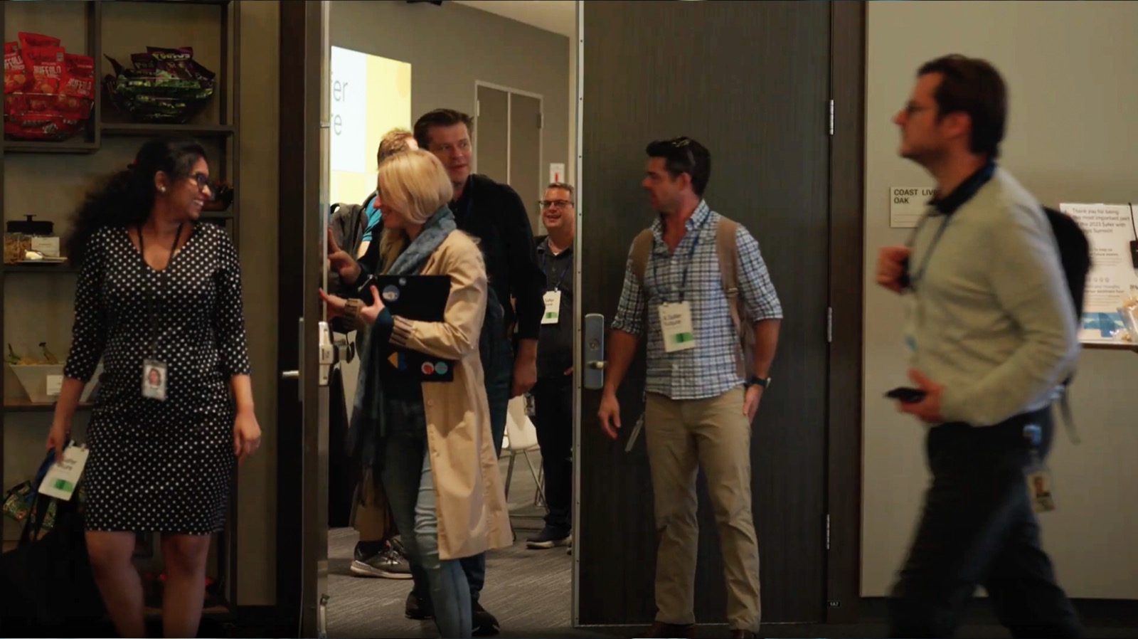 Attendees mingling in the hallway between sessions